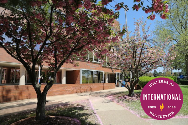 Trees and the exterior of a campus building with the