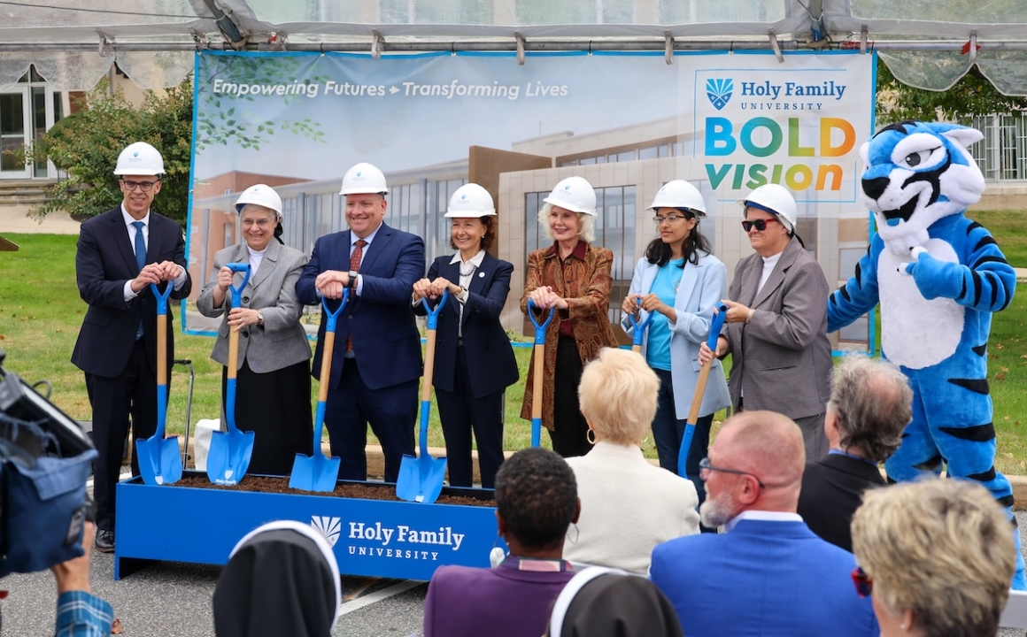 Representatives from 买球app with shovels in hand at the official groundbreaking of the HFH expansion