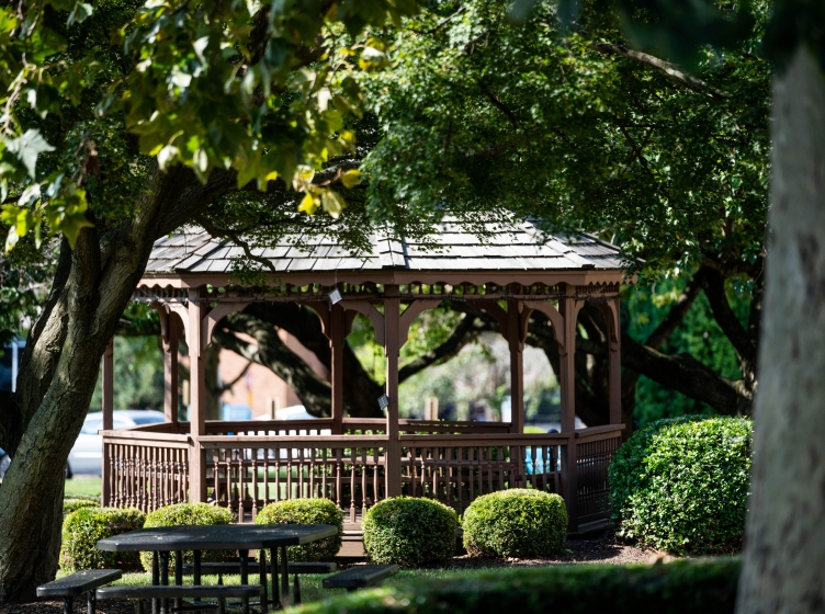 Gazebo on 买球app's campus seen through the trees